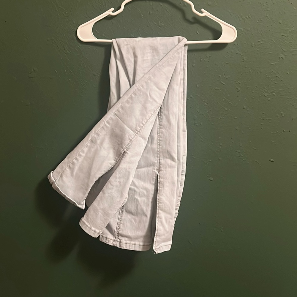 light wash flare jeans with ankle slit